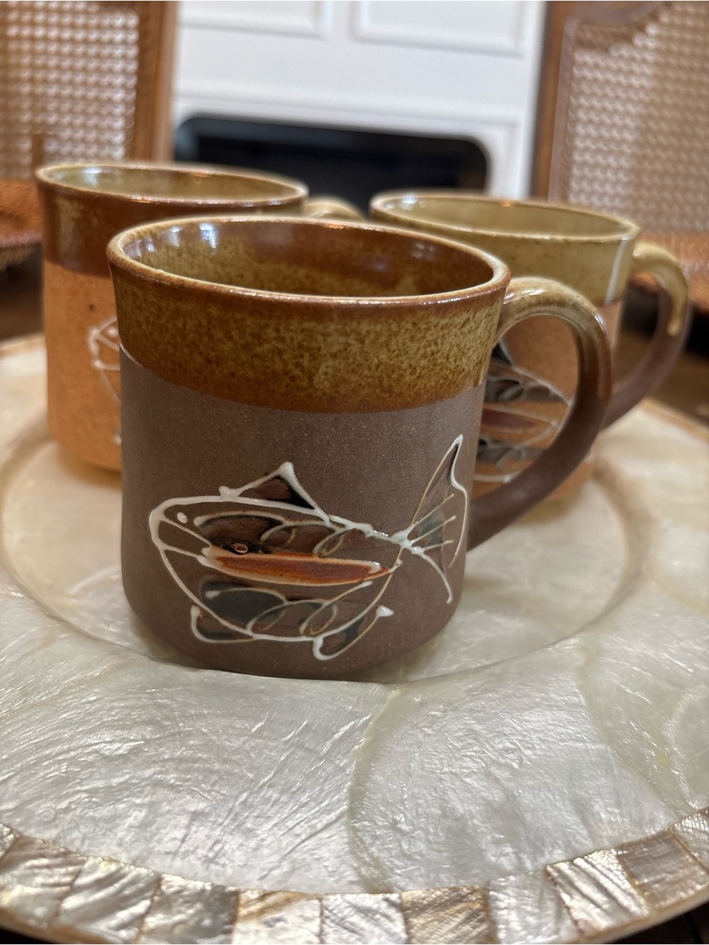 Three vintage stoneware pottery mugs with hand painted fish